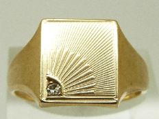 A 9ct gold signet ring set with a diamond, size U, 6.