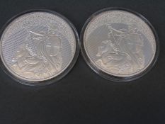 A double leopard oversize coin together with a 2016 'one million pound' example