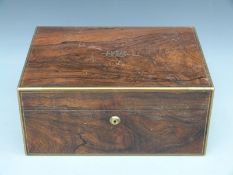 A 19thC rosewood brass bound jewellery box with lift out leather trays and a Bramah lock,