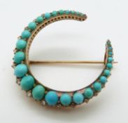 A Victorian crescent brooch set with graduated turquoise and rose cut diamonds