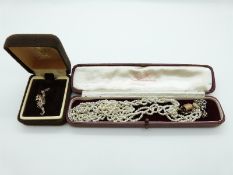 A Victorian three strand plaited cultured seed pearl necklace with rose gold clasp,