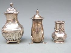 Three various hallmarked silver peppers,