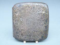 Edward VII hallmarked silver cigarette case with engraved decoration,