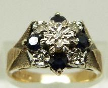 A 9ct gold ring set with diamonds and sapphires in a cluster, size K, 4.