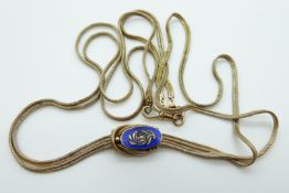 A Victorian two-strand rope necklace with knotted effect holding a blue enamel panel set with seed