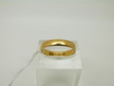 A 22ct gold ring/ wedding band, size R, 2.