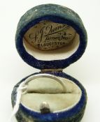 A white metal wedding band in original Gloucester ring box, size M, 2.