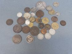 A small but interesting collection of 19th / early 20thC overseas and UK coins and tokens,