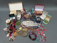A collection of costume jewellery to include beaded necklaces, faux pearls,
