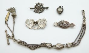 A hallmarked silver Mizpah brooch, a hallmarked silver swallow brooch, compass charm,