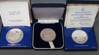 Barbados 10 dollar cased silver coin together with a Philippines 50 piso proof coin and a Cook
