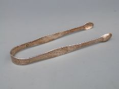 A pair of Georgian Hester Bateman hallmarked silver bright cut sugar tongs,