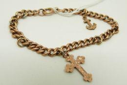 A 9ct rose gold curb link bracelet with 9ct gold cross pendant/ charm and a 9ct gold anchor charm/