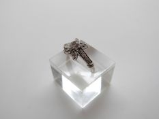 An 18ct gold ring set with diamonds in a floral cluster, the largest approximately 0.