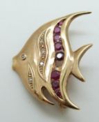 A 9ct gold brooch in the form of a fish set with rubies and diamonds, 4.
