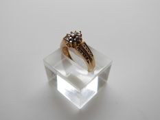 A 10k gold ring set with diamonds, size N, 3.
