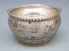 Danish white metal bowl with hammered finish, and glass liner,