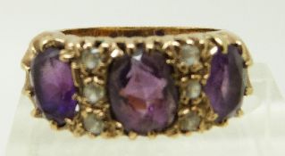 A 9ct gold ring set with three large amethysts and paste in original box, size J/K, 6.
