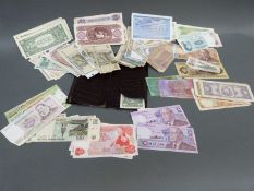 A collection of all world bank notes including USA dollars, five consecutive examples,