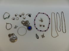 A collection of silver jewellery including pendants, large chains,