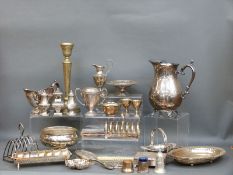 A quantity of silver plate to include large jug, sauce boats, toast racks, salt and pepper shakers,