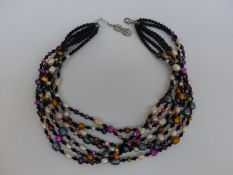 Butler & Wilson seven strand necklace made up of coloured pearls and French jet beads in original