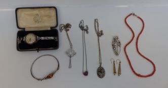 A collection of silver to include pendants, coral necklace, chains, bracelet,
