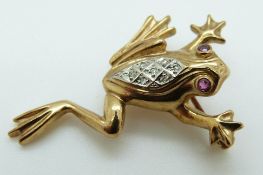 A yellow metal frog brooch set with ruby eyes and diamonds to the body, 4.