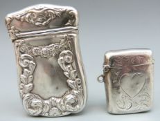An early 20th century hallmarked silver vesta case with engraved heart together with an American