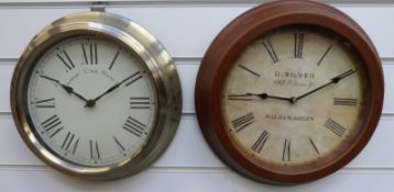 Two quartz dial wall clocks, both with Roman numerals, 'D Silver' to one,