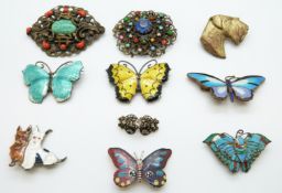 Two silver brooches set with enamel in the form of butterflies and further brooches including