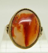 A 9ct gold ring set with an agate cabochon, size J, 5.