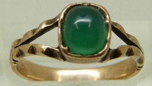A Victorian ring set with a green cabochon, size J/K, 2.