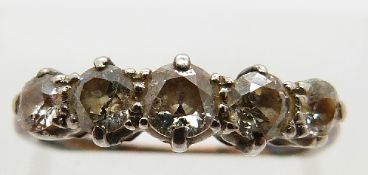 An 18ct gold ring set with five graduated old cut diamonds, size K, 2.