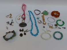 A collection of jewellery including silver earrings, silver chains, silver watch strap,