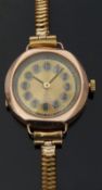 9ct gold ladies wristwatch with black hands, gold face,