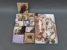 A collection of jewellery to include a paste bangle, Venetian glass beaded necklace,