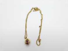 A 9ct gold necklace and pendant set with two rubies, 4.