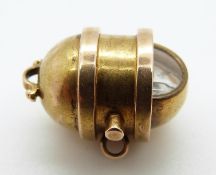 A Victorian charm in the form of a ship's gimbal compass