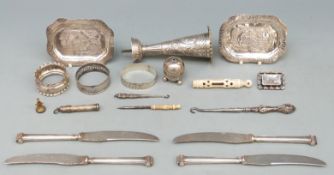 A quantity of hallmarked silver items including three napkin rings and pepper 57g,