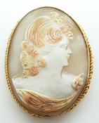 A yellow metal brooch set with a cameo depicting a lady