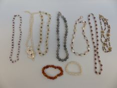 A collection of necklaces including amethyst and pearl, pearl and ruby, garnet and pearl,