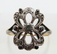 A yellow metal ring set with diamonds and sapphires in a platinum setting, size K, 3.