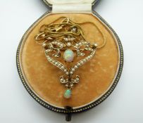 Art Nouveau 9ct gold pendant set with opals and seed pearls on a 9ct gold chain,