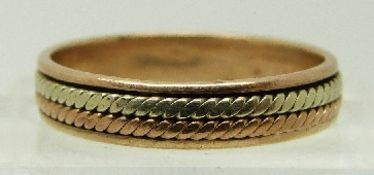 A 9ct bi-coloured gold ring with rope design, size L, 2.