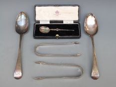 Two pairs of Georgian hallmarked silver sugar tongs one with bright cut decoration,