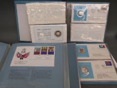 Two folders containing coin covers commemorating the 1975 United Nations,