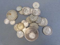 A George III crown together with 95g of mixed silver coins