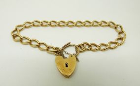 An 18ct gold bracelet with heart padlock clasp, 16.