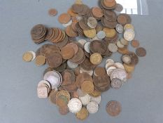 A collection of UK and overseas coins George II onwards, small silver content,